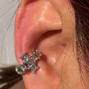 Stylish touch with this cross ear cuff