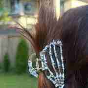 Silver metal claw clip with skeleton hand design