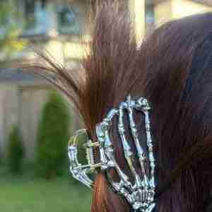 Silver metal claw clip with skeleton hand design